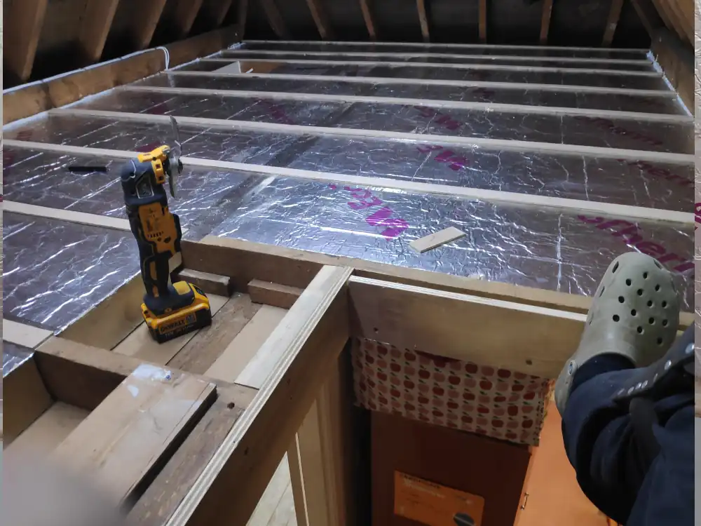Home Mal installing ceiling insulation