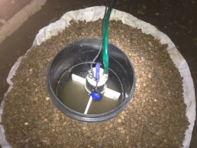 garden flood protection sump showing pump mounting