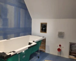 Mal's pre-finished bath and concealed shower and also the magnetic access hatch for ventilation fan servicing