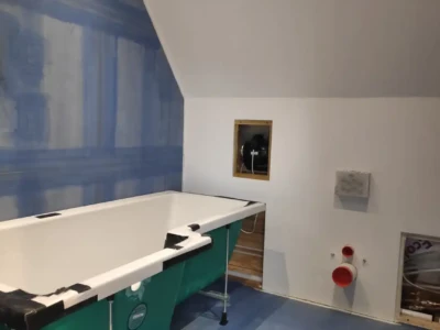 Mal's pre-finished bath and concealed shower and also the magnetic access hatch for ventilation fan servicing