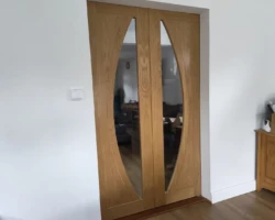 Mal completes a pocket sliding door into the new extension lounge